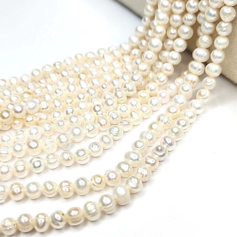 Жемчуг натуральный 6х5,5 мм округлой формы, культивированный, нить 35 см